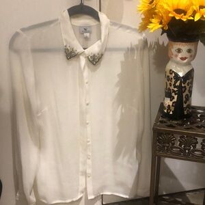 Beautiful, semi sheer blouse with beautiful rhinestone collar. Size large